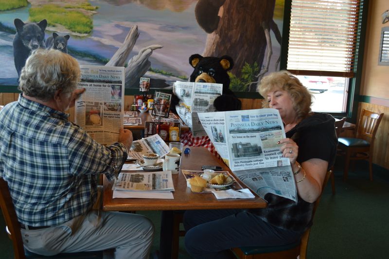 Reading Newspapers with Breakfast