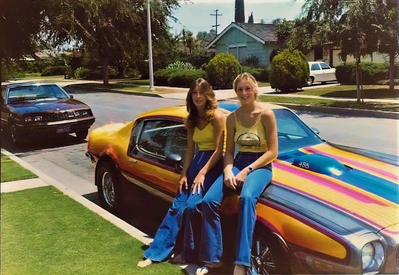 Teens Posing on Hoods in Bell Bottoms