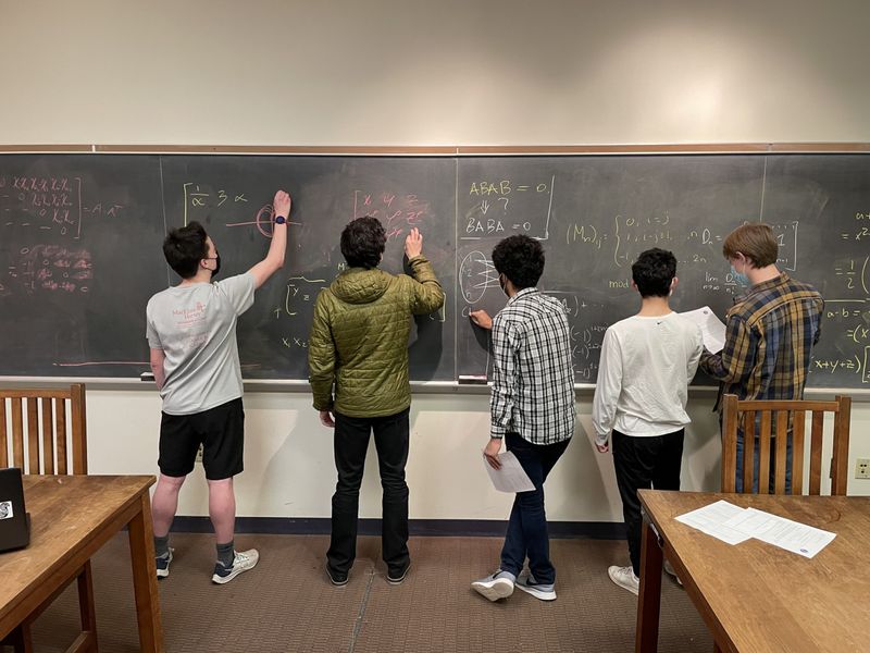 Dueling Students at the Board for Math Problem Glory