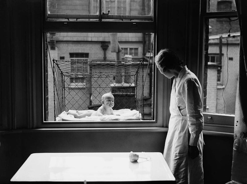 Baby Cages Hanging From Windows